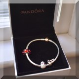 J05. Pandora bracelet with charms. 